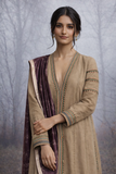 A LINEN JACKET LAYERED OVER A BROWN TUSSAR SAREE, BLENDING STRUCTURE WITH SOFT DRAPE.