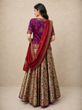 VIBRANT MAGENTA LEHENGA SET FEATURING INTRICATE EMBROIDERY, FLORAL PATTERNS, AND A RICHLY DETAILED DUPATTA.