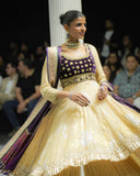 GOLD TISSUE CRUSHED ANARKALI PAIRED WITH A GREEN EMBROIDERED KOTI, SHARARA, AND PURPLE ANTIQUE EMBROIDERED DUPATTA. (4 PCS)