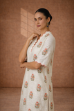 IVORY SILK CHANDERI TUNIC WITH DELICATE FLORAL BUTA AND SCALLOPED NECKLINE DETAILS