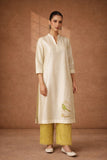 A TIMELESS IVORY CHANDERI SET WITH MINIMAL DETAILING.