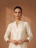 A TIMELESS IVORY CHANDERI SET WITH MINIMAL DETAILING.
