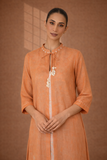 A SOFT ORANGE KOTA SET WITH DELICATE DETAILING FOR EFFORTLESS DAY ELEGANCE