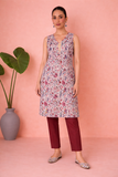 AN IVORY TUNIC DEFINED BY DELICATE PATTERNING AND EFFORTLESS EASE