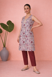 AN IVORY TUNIC DEFINED BY DELICATE PATTERNING AND EFFORTLESS EASE
