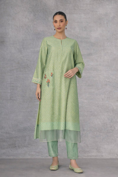 A SOFT GREEN KURTI DEFINED BY GENTLE DETAILING AND FLUID EASE