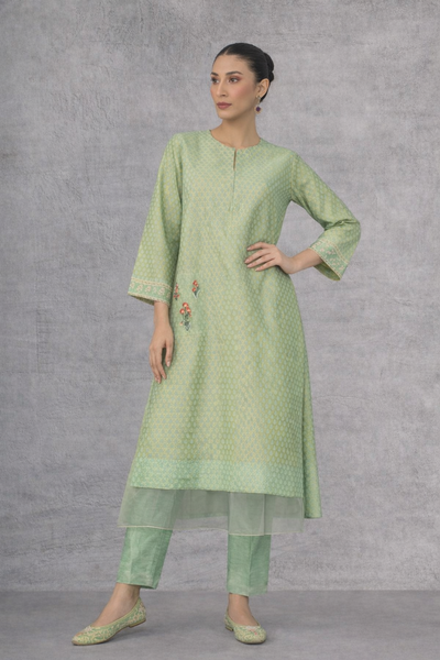 A SOFT GREEN KURTI DEFINED BY GENTLE DETAILING AND FLUID EASE