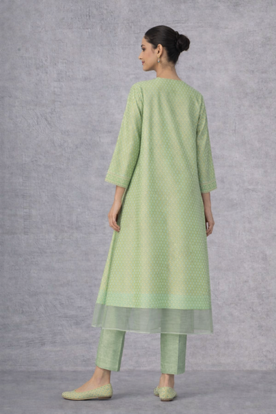 A SOFT GREEN KURTI DEFINED BY GENTLE DETAILING AND FLUID EASE