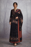 A BLACK EMBROIDERED DUPION SILK JACKET PAIRED WITH A PRINTED TUSSAR SILK SAREE