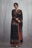 A BLACK EMBROIDERED DUPION SILK JACKET PAIRED WITH A PRINTED TUSSAR SILK SAREE