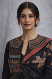 A BLACK EMBROIDERED DUPION SILK JACKET PAIRED WITH A PRINTED TUSSAR SILK SAREE