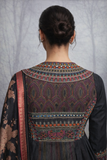 A BLACK EMBROIDERED DUPION SILK JACKET PAIRED WITH A PRINTED TUSSAR SILK SAREE