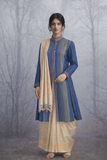 A BLUE COTTON HANDLOOM JACKET PAIRED WITH A BEIGE TUSSAR SILK SAREE.