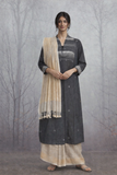 A BLACK HANDLOOM COTTON JACKET WITH MINIMAL WOVEN DETAILS.