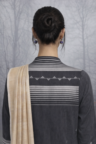 A BLACK HANDLOOM COTTON JACKET WITH MINIMAL WOVEN DETAILS.