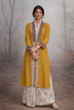 A MUSTARD LINEN JACKET PAIRED WITH A BEIGE TUSSAR SAREE, CRAFTED FOR QUIET IMPACT.