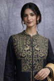 BLACK EMBROIDERED LINEN JACKET PAIRED WITH A GOLDEN-YELLOW SILK TISSUE SAREE