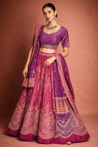 A RICH PURPLE DUPION SILK EMBROIDERED BLOUSE PAIRED WITH A HEAVY FALSA SCALLOP LEHENGA AND A MATCHING PURPLE DUPATTA.(FB-01)