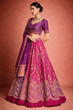 A RICH PURPLE DUPION SILK EMBROIDERED BLOUSE PAIRED WITH A HEAVY FALSA SCALLOP LEHENGA AND A MATCHING PURPLE DUPATTA.(FB-01)
