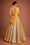 A YELLOW LEHENGA PAIRED WITH A MATCHING EMBROIDERED BLOUSE AND A SOFT POWDER BLUE PANEL WITH DUPATTA.(KA-01B)