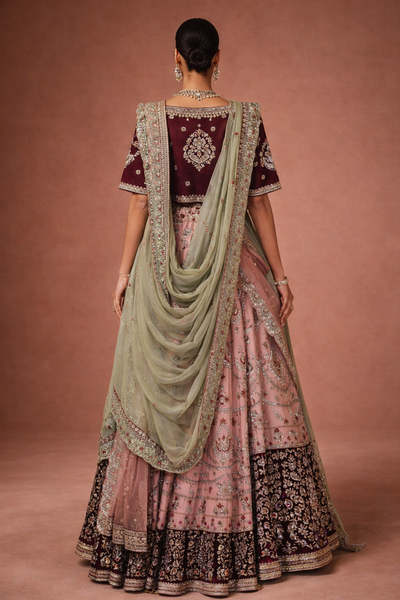 A BLUSH PINK LEHENGA PAIRED WITH A DEEP WINE EMBROIDERED BLOUSE (TL-103)