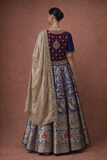 A ROYAL BLUE LEHENGA PAIRED WITH A DEEP WINE EMBROIDERED BLOUSE AND A SOFT GOLD DUPATTA.(TL-013)