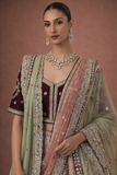 A BLUSH PINK LEHENGA PAIRED WITH A DEEP WINE EMBROIDERED BLOUSE (TL-103)