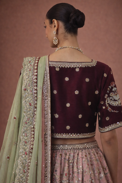 A BLUSH PINK LEHENGA PAIRED WITH A DEEP WINE EMBROIDERED BLOUSE (TL-103)