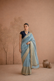 POWDER BLUE TISSUE SAREE WITH ZARI WOVEN BORDER AND BLOUSE PIECE (2PCS)