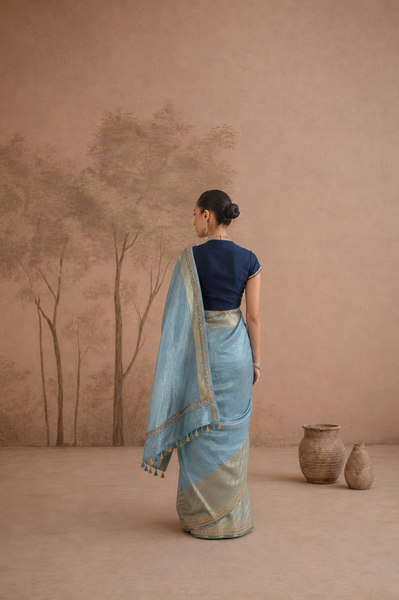 POWDER BLUE TISSUE SAREE WITH ZARI WOVEN BORDER AND BLOUSE PIECE (2PCS)