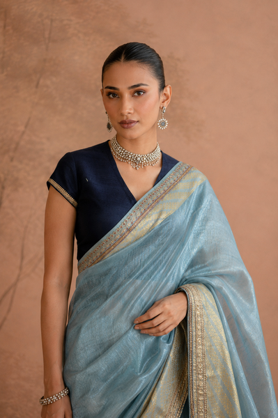 POWDER BLUE TISSUE SAREE WITH ZARI WOVEN BORDER AND BLOUSE PIECE (2PCS)