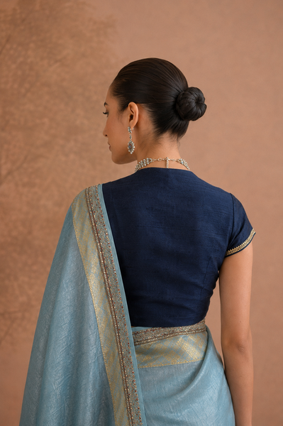 POWDER BLUE TISSUE SAREE WITH ZARI WOVEN BORDER AND BLOUSE PIECE (2PCS)