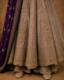 TAUPE ANARKALI SET FEATURING INTRICATE EMBROIDERY AND A RICH PURPLE EMBELLISHED DUPATTA