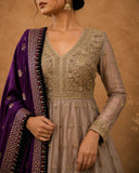 TAUPE ANARKALI SET FEATURING INTRICATE EMBROIDERY AND A RICH PURPLE EMBELLISHED DUPATTA