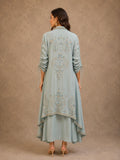 POWDER BLUE INNER DRESS PAIRED WITH AN EMBROIDERED CAPE JACKET FOR AN EFFORTLESSLY ELEGANT LOOK.