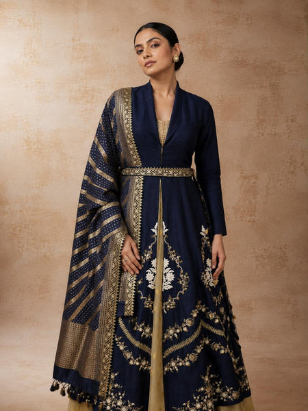 A NAVY BLUE EMBROIDERED JACKET SET WITH A CONTRAST GOLD ANARKALI AND A WOVEN DUPATTA.(5PCS)