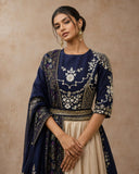 A NAVY BLUE EMBROIDERED BLOUSE PAIRED WITH A CONTRAST GOLD SKIRT AND A MATCHING DUPATTA.(3PCS)