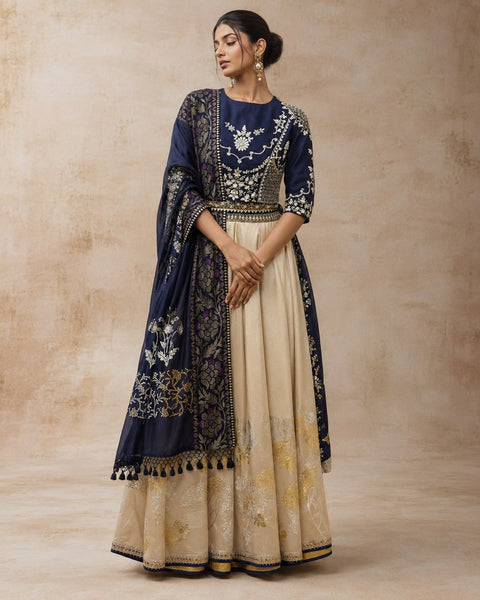 A NAVY BLUE EMBROIDERED BLOUSE PAIRED WITH A CONTRAST GOLD SKIRT AND A MATCHING DUPATTA.(3PCS)