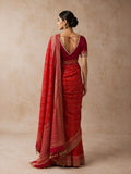 A BRIGHT RED SAREE WITH GEOMETRIC PATTERNS AND A DETAILED GOLD BORDER.(2PCS)