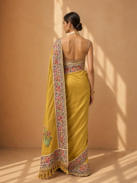 MUSTARD SILK SAREE WITH KASHMIR EMBROIDERED BORDER PAIRED WITH UNSTITCHED BLOUSE PIECE. (2PCS)