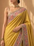 MUSTARD SILK SAREE WITH KASHMIR EMBROIDERED BORDER PAIRED WITH UNSTITCHED BLOUSE PIECE. (2PCS)