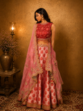 PINK LEHENGA SET FEATURING INTRICATE EMBROIDERY, FLORAL MOTIFS, AND A DELICATELY EMBELLISHED DUPATTA.