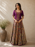 VIBRANT MAGENTA LEHENGA SET FEATURING INTRICATE EMBROIDERY, FLORAL PATTERNS, AND A RICHLY DETAILED DUPATTA.