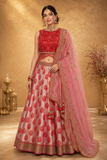 PINK LEHENGA SET FEATURING INTRICATE EMBROIDERY, FLORAL MOTIFS, AND A DELICATELY EMBELLISHED DUPATTA.